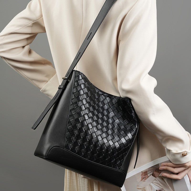 This designer black woven tote bucket bag is versatile, suitable for work, meeting, beach and festival.