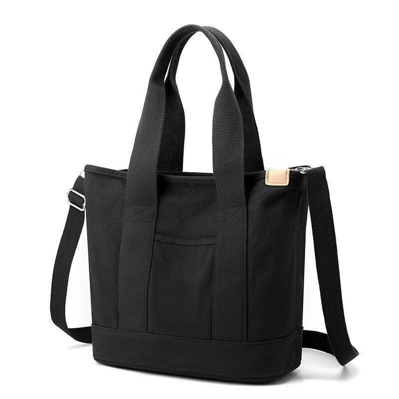The large black zipper canvas tote bag has a crossbody strap, suitable for beach, work and travel.