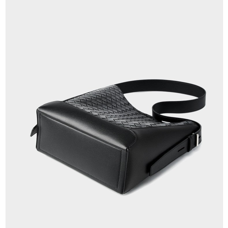 This is the bottom display of the stylish woven bucket hobo crossbody shoulder bag, which shows its unique structure and craftsmanship.