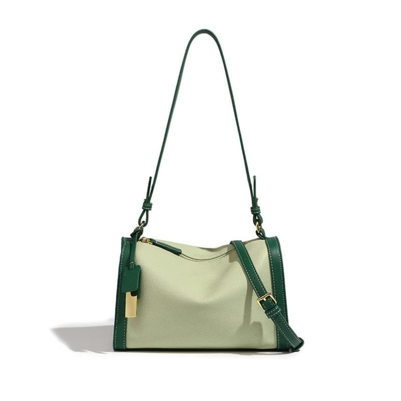 This mint green boston bag is made of TOGO genuine leather.