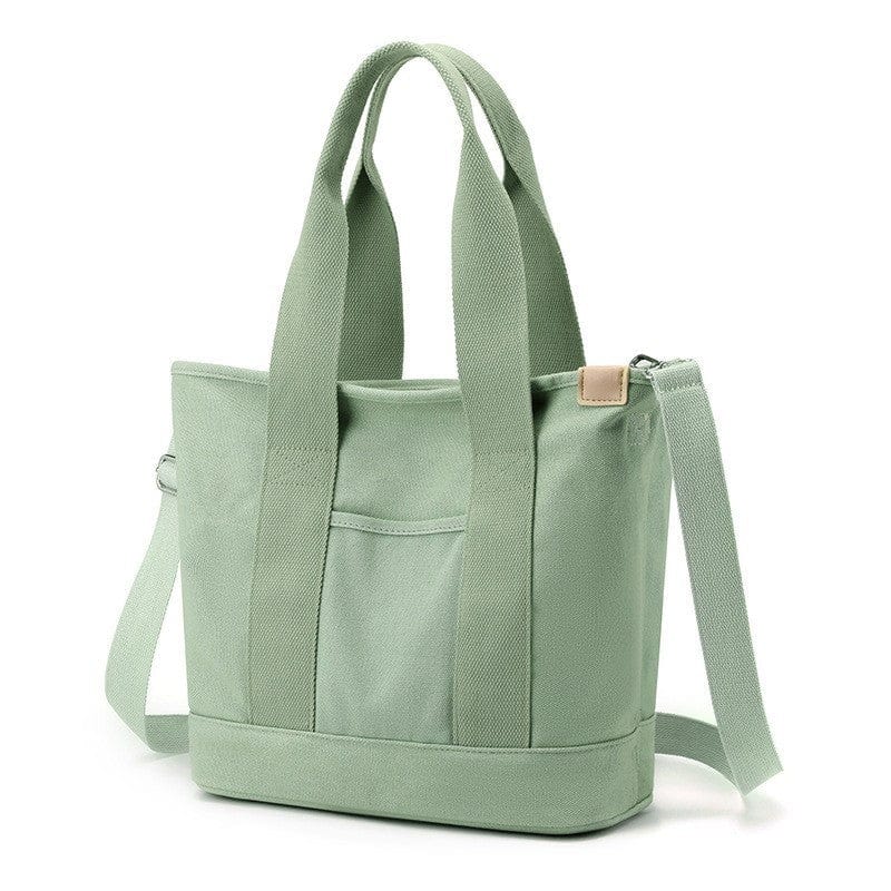 The large mint green zip tote bag for ladies is ideal for travel, work, beach and school.