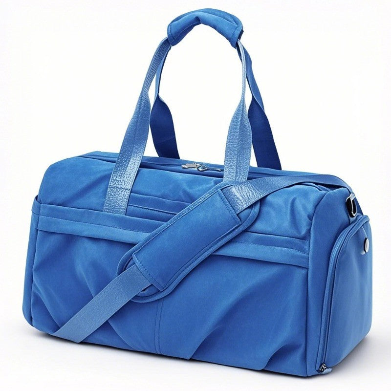 There is a navy blue garment duffle travel bag with crossbody strap