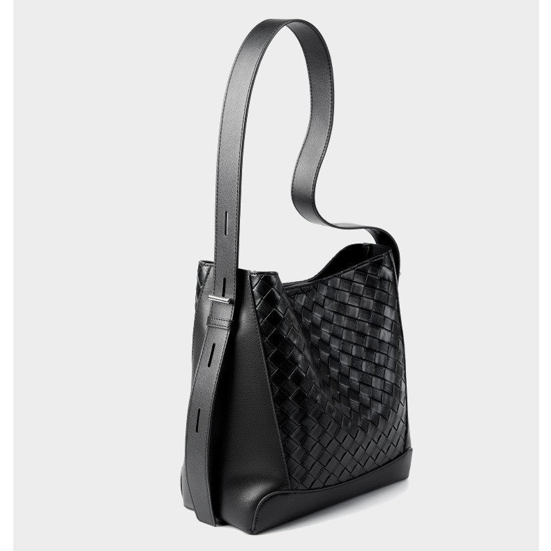 This is the side display of the black woven bucket tote bag, it is spacious and with adjustable sling crossbody strap.