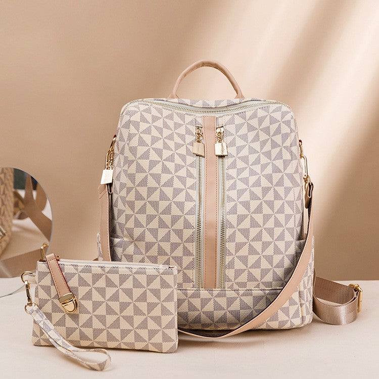 The Windmill beige convertible 14 inch laptop backpack for ladies come with a one shoulder strap and a anti theft wristlet clutch.