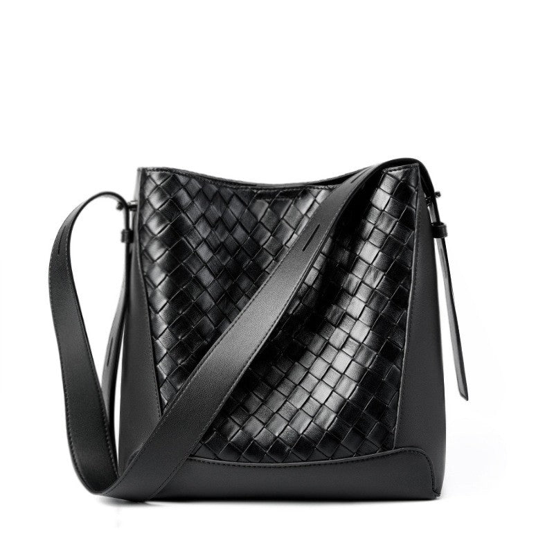 The black woven tote bucket hobo bag is made of soft genuine leather, with an adjustable crossbody sling strap.