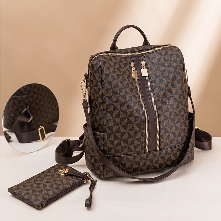 The women's brown coffee convertible shoulder 14 in laptop backpack come with a wristlet clutch.