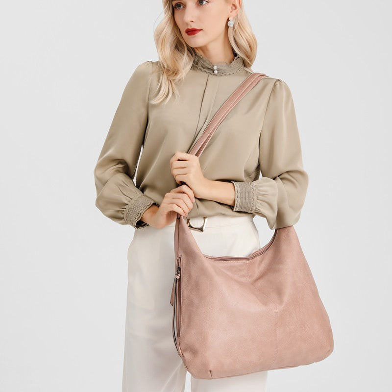 The hobo shoulder bag has a sling crossbody strap, can be carried by crossbody.