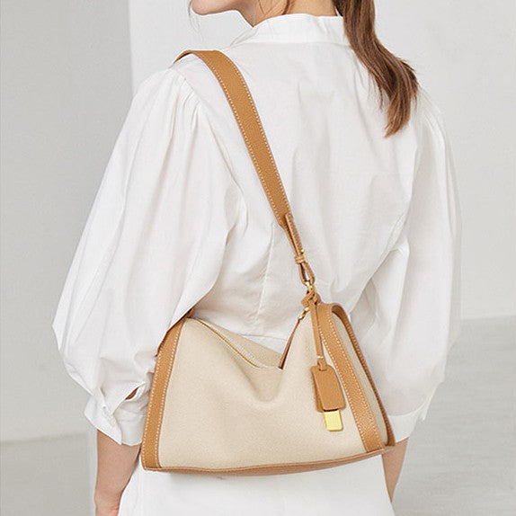 The khaki boston hobo shoulder bag is made of TOGO genuine leather.