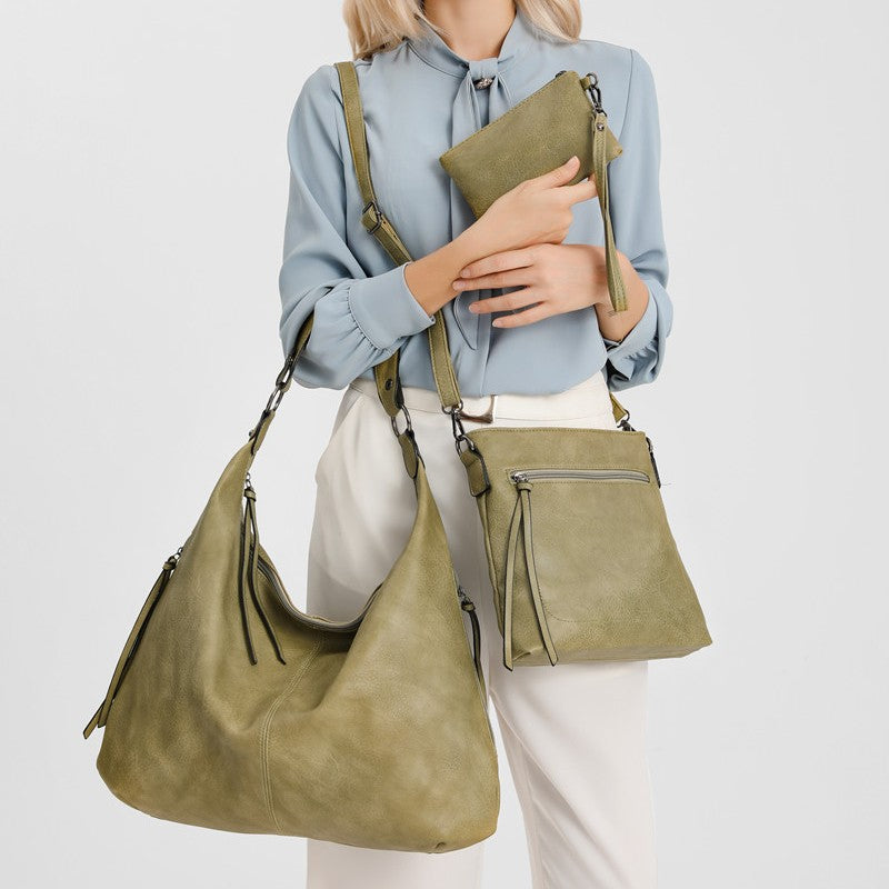 This is the usage display of the multi-functional 3 in 1 green bag set. You can carry the tote hobo bag in your hand or on your shoulder, carry the messenger bag crossbody, and clutch the pouch purse.