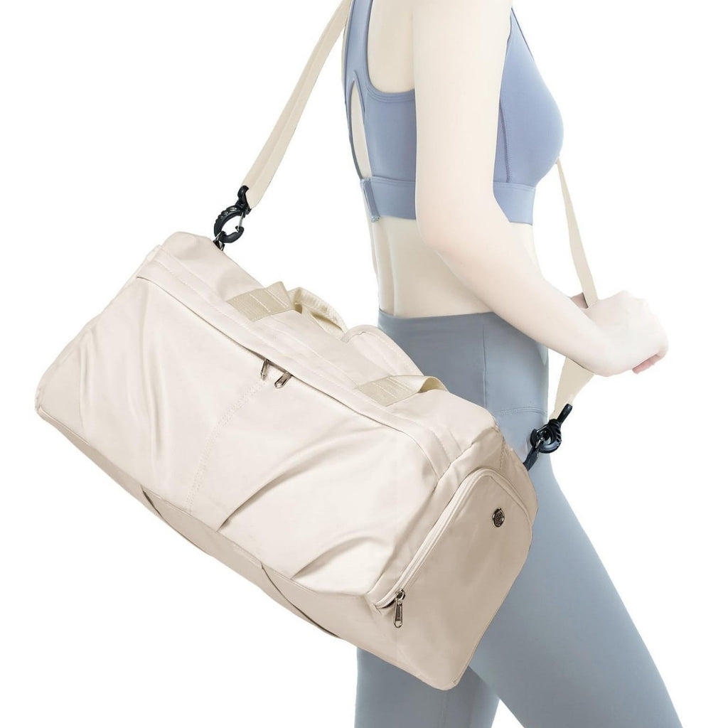Best beige travel duffel bag for women travel, going to gym, excercise, can be carried by handheld or cross body