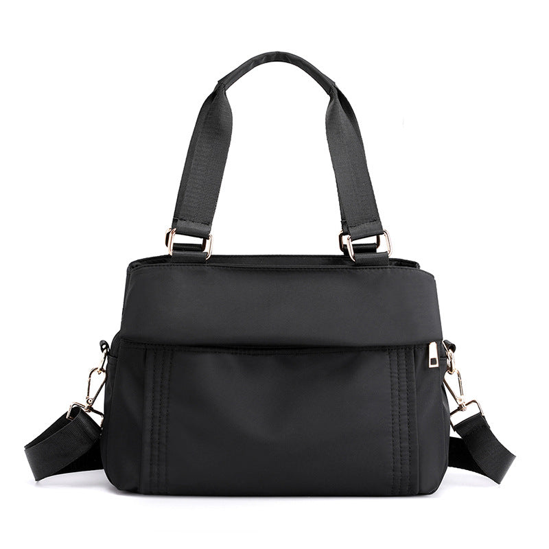 The black top handle tote bag has a replacement crossbody bag