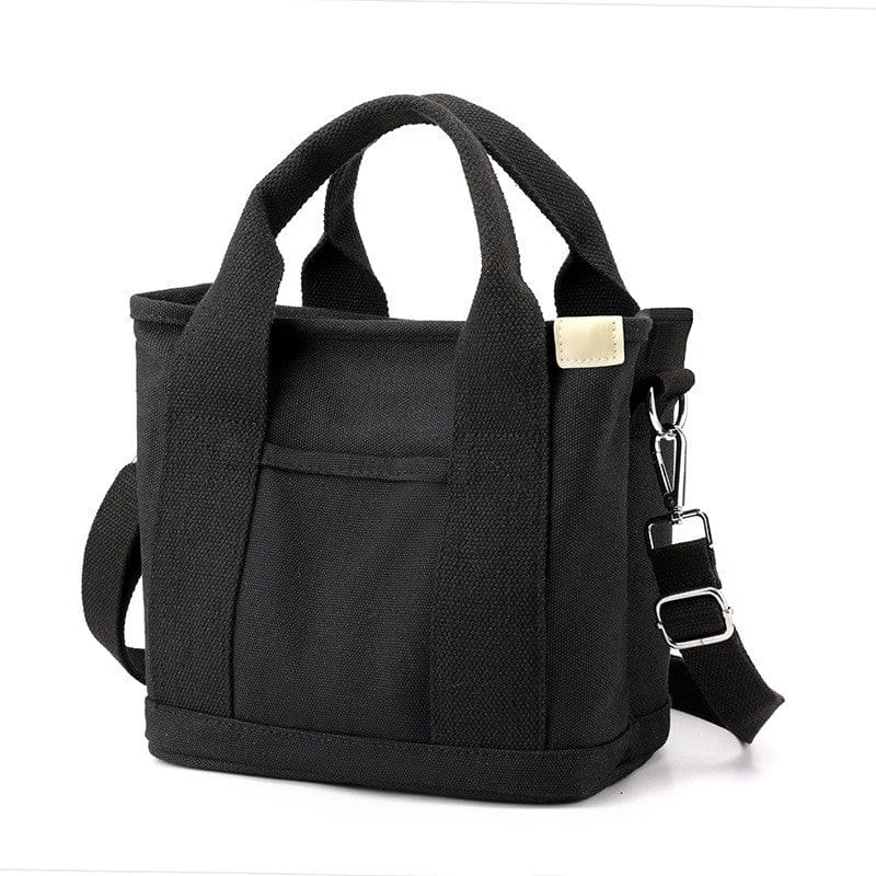 The small black zipper canvas tote bag has a crossbody strap, suitable for beach, work and travel.
