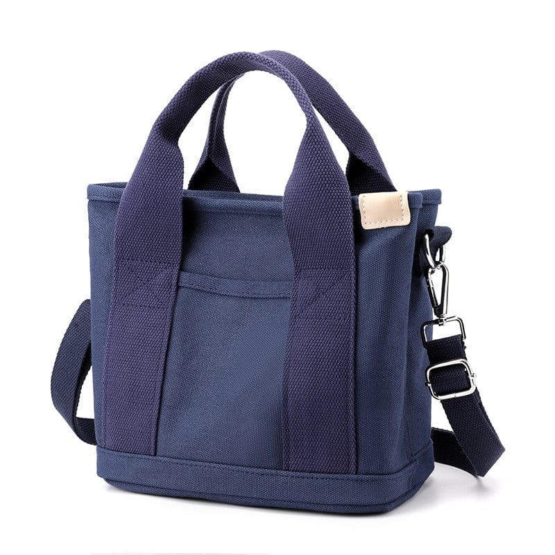The best small blue zipper canvas tote bag has soft handles and crossbody strap, suitable for students.