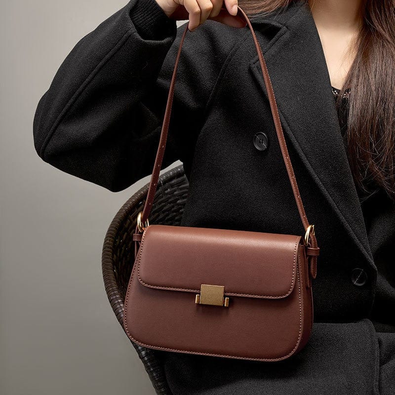 The brown genuine leather square flap bag can be carried on the shoulder, crossbody or handheld