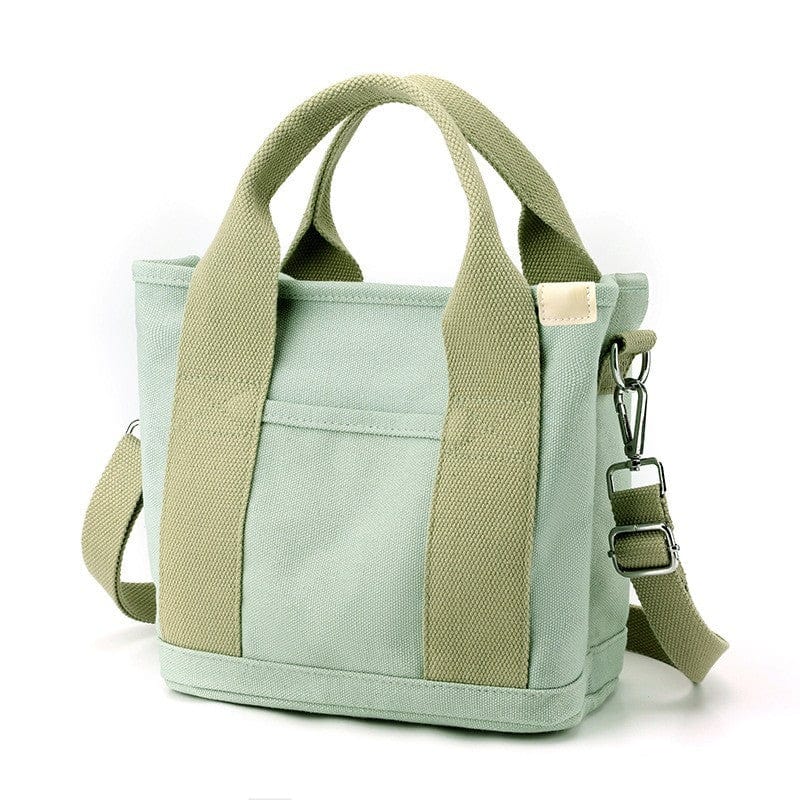 The green tote bag is made of canvas material and with zipper