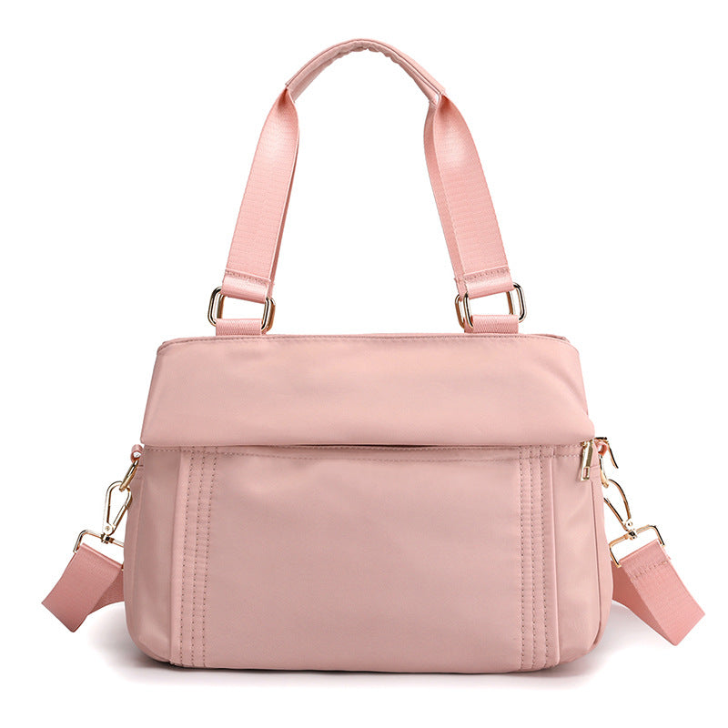 This is the pink top handle work tote handbag with a replacement crossbody sling strap.