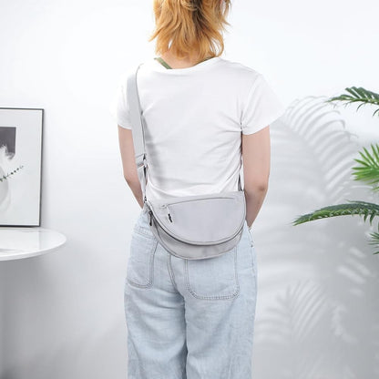 A belluova grey crossbody bag is mini and can be worn crossbody, over the shoulder, across the chest or around the waist.