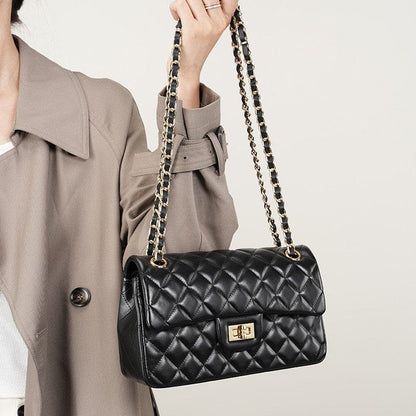This black flap sling shoulder bag is adjustable; it can be carried by crossbody or on the shoulder.