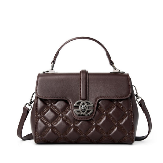 This is the display of the brown mini flap crossbody bag, it has top handle and adjustable sling strap.