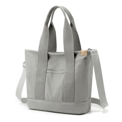 The medium grey zip tote bag for ladies is ideal for travel, work, beach and school.